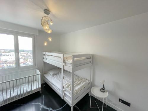 Ένα ή περισσότερα κρεβάτια σε δωμάτιο στο Atypaluxe Appartement 3 chambres