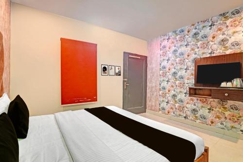 Postel nebo postele na pokoji v ubytování Hotel O Ace