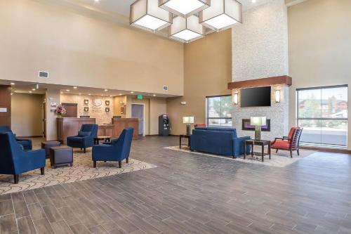 a lobby with chairs and a waiting room at Comfort Suites Billings in Billings