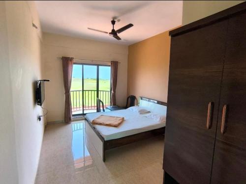 Postel nebo postele na pokoji v ubytování SV Inns Sea Pearl