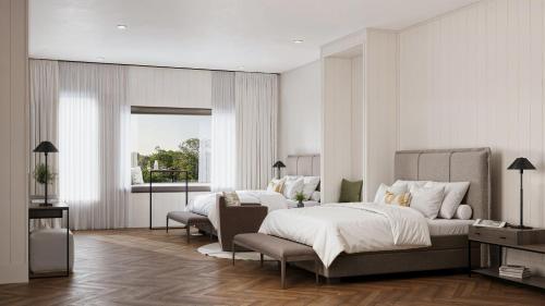 a bedroom with a bed and a chair in it at 360 Hotel Boutique and Spa in Selfoss