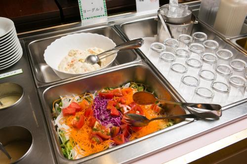 a tray of food with utensils in a kitchen at Hotel Sunroute Tochigi in Tochigi