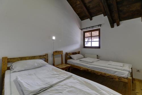 En eller flere senge i et værelse på Srna Etno Selo - Hotel i Restoran