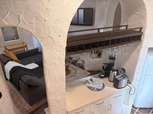 a living room with a loft bed in a kitchen at Tropical Spanish Style Cabana - New Listing! in Sydney