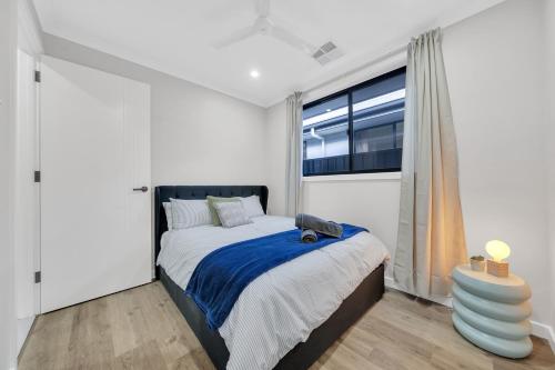 En eller flere senge i et værelse på Luxury on Leeds