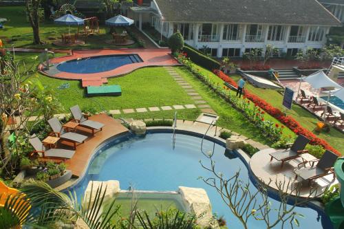an overhead view of a swimming pool in a yard at Concordia Hotel Bumi Sangkuriang Bandung in Bandung
