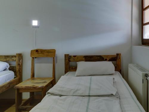 En eller flere senge i et værelse på Srna Etno Selo - Hotel i Restoran