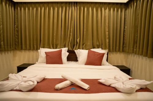 En eller flere senge i et værelse på Lotus Lagoona Beach Resort