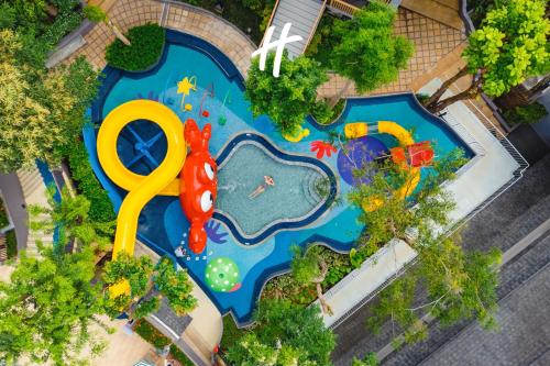 an overhead view of a pool with a water park at Holiday Inn Resort Krabi Ao Nang Beach by IHG in Ao Nang Beach