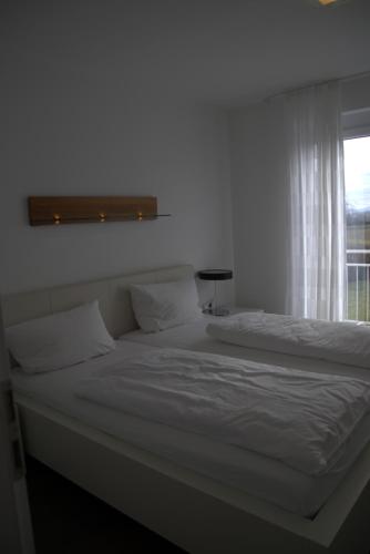 Postel nebo postele na pokoji v ubytování Destination Markgräfler Land