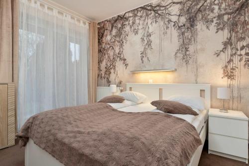 Family Apartment with Garden and Two Parking Spaces in Gdańsk by Noclegi Renters
