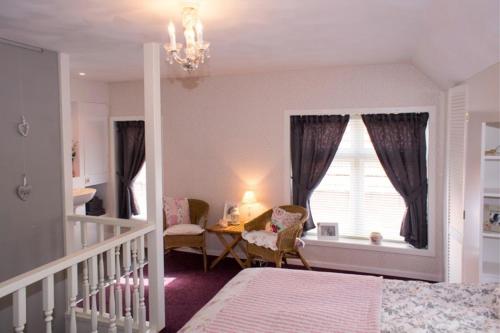 Postel nebo postele na pokoji v ubytování Beleef het Noorden