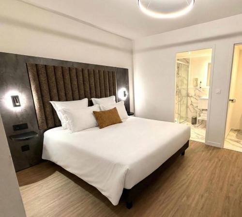 Postel nebo postele na pokoji v ubytování Nehô Suites Saint Jean de Maurienne