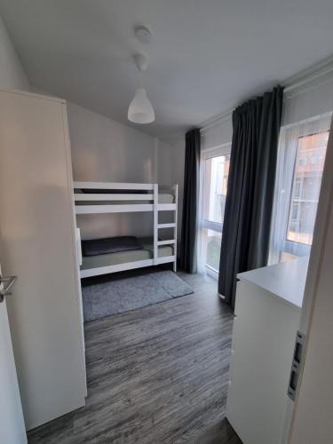 a small room with a bed and a window at Ferienwohnung Euchen 2 in Würselen