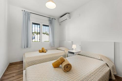 En eller flere senge i et værelse på La Casa de la Cala del Moral