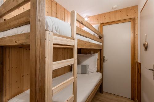 Llit o llits en una habitació de Le Cocon du Prarion