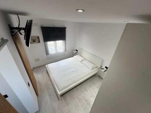 En eller flere senge i et værelse på Princesa 202