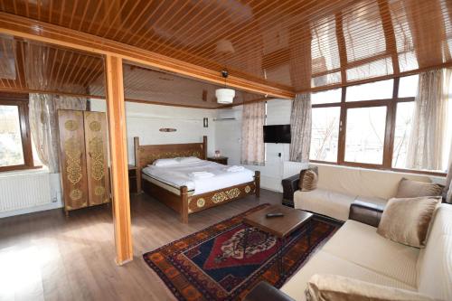 En eller flere senge i et værelse på Peri Cave Hotel