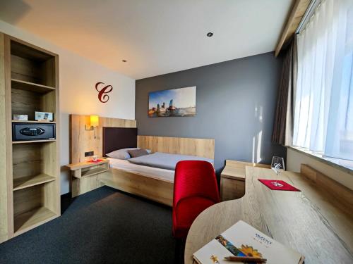 Giường trong phòng chung tại Akzent Hotel Cordes & Restaurant am Rosengarten