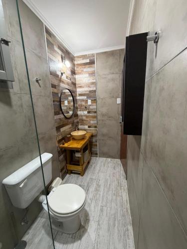 a bathroom with a toilet and a sink at CABAÑAS MECHI in Mar del Plata