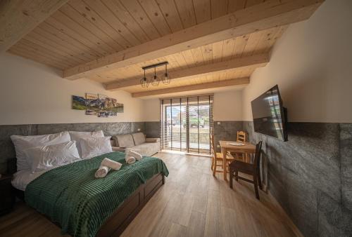 En eller flere senge i et værelse på Apartamenty Premium Rysulówka