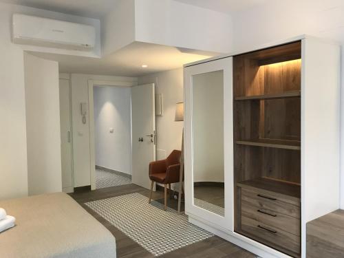 En eller flere senge i et værelse på COSTERA TERRAZA - HappyVila