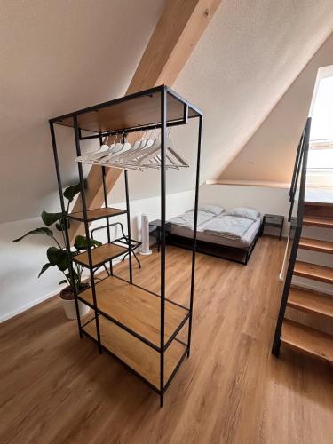 a black bunk bed in a room with a bed at Style Loft mit Ausblick in Elzach in Elzach