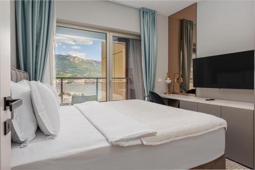 Postelja oz. postelje v sobi nastanitve Hotel Harmonia by Dukley