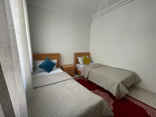 a room with two beds in a room at Atlas Sunset Lodge in Agadir