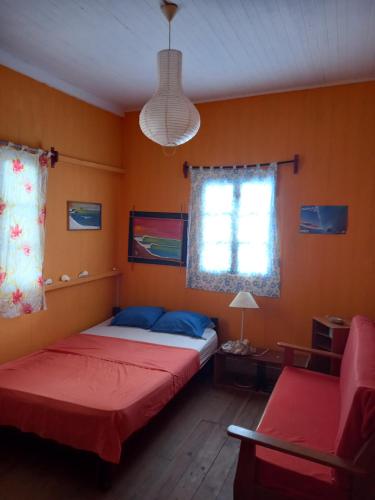 Giường trong phòng chung tại Casa De Darwin