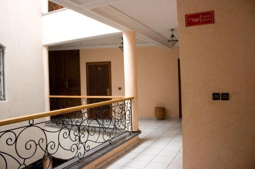 a balcony with a wrought iron railing in a building at Hotel Bab Boujloud in Fès