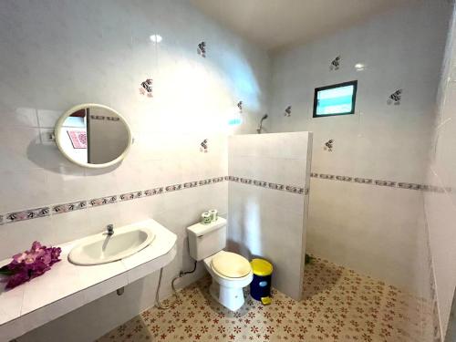 a bathroom with a sink and a toilet and a mirror at Central Essence-200m beachKoh Phangan west coast in Haad Chao Phao