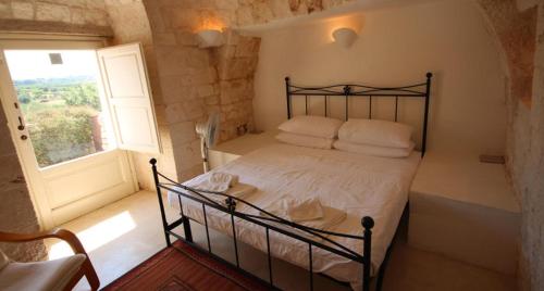 Een bed of bedden in een kamer bij Trullo Annina
