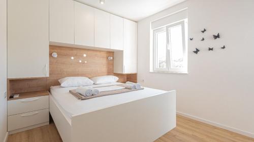 En eller flere senge i et værelse på Holiday home Iva by Villas Guide