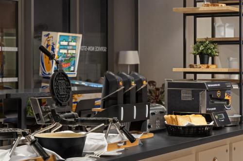 a counter with some food on top of it at Hilton Garden Inn Bordeaux Centre in Bordeaux