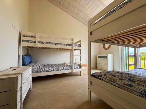 a bedroom with two bunk beds and a window at -La Bella Ameglia- Private Parking in Luni