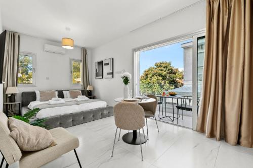 a living room with a couch and a table at STYLE°LIMASSOL in Limassol