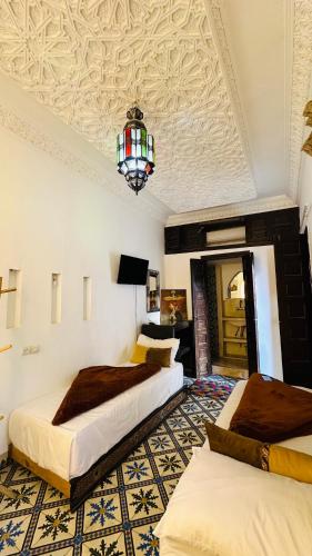 En eller flere senge i et værelse på Riad 46