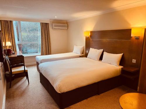 Ένα ή περισσότερα κρεβάτια σε δωμάτιο στο Gainsborough House Hotel