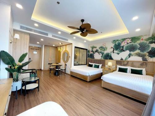 En eller flere senge i et værelse på FLC Sea Tower Quy Nhơn- The Beach