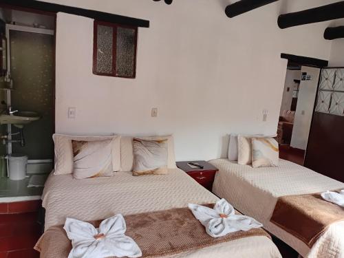 En eller flere senge i et værelse på Aparta Hotel Eucalyptus