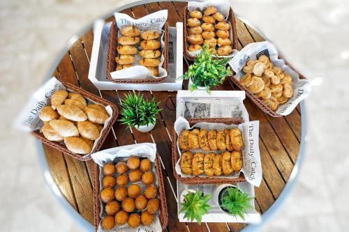a table with many baskets of food on it at Bahia Blanca in Puerto Rico de Gran Canaria