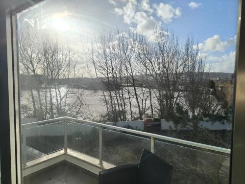 a balcony with a view of a river from a window at Beach Hub in São Martinho do Porto