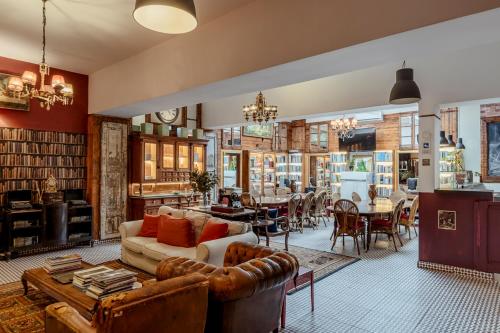 a living room with a couch and a table at Labor Alliance Residence by LovelyStay in Lisbon