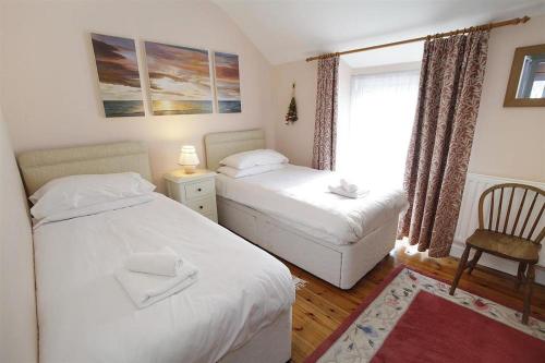 En eller flere senge i et værelse på 2 Bed in Mumbles oc-hh120