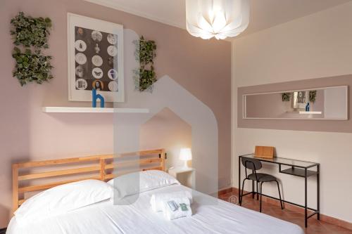 Postel nebo postele na pokoji v ubytování Homiday - Tuscany House - Parcheggio e Giardino Privato