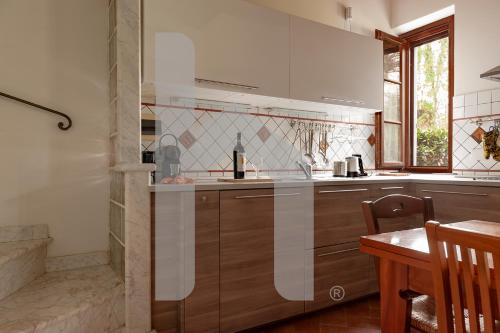 Kuchyň nebo kuchyňský kout v ubytování Homiday - Tuscany House - Parcheggio e Giardino Privato