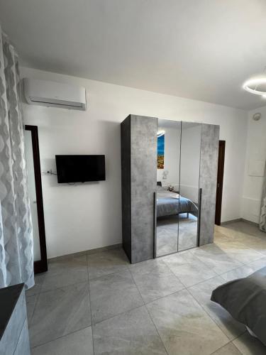 En eller flere senge i et værelse på Pompei Comfort Room