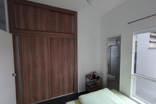 En eller flere senge i et værelse på Acomodação Tranquila