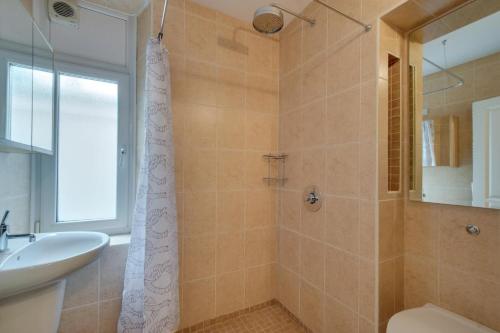 a bathroom with a shower and a sink at 1 Bed in Mumbles oc-hh1205 in The Mumbles